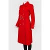 Red coat fitted with a belt