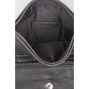 Black leather handbag on a zipper and button