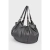 Black leather bag with wicker handles