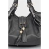 Black leather bag with wicker handles