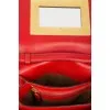 Red leather bag with gold-tone metal hardware