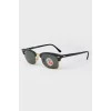 Black sunglasses with glass lenses with a tag