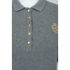 Gray polo with golden buttons