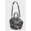 Black leather zip bag with tag