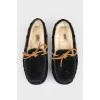 Insulated black moccasins on fur