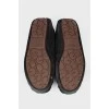 Insulated black moccasins on fur