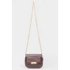 Purple handbag with lacquered inserts