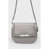 Gray handbag with varnished inserts