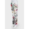 White jeans with multicolour prints and inserts