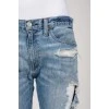 Blue jeans with scuffs and decorative slots