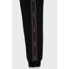 Black trousers with red and black stripes