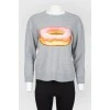 Gray sweatshirt with an embroidered donut