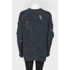 Dark blue knitted sweater of a free cut