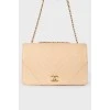 Beige bag with tint on a chain