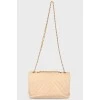 Beige bag with tint on a chain