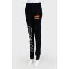 Sports trousers with emblem