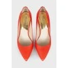 Red stiletto heeled pumps