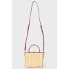 Straw bag with snake leather inserts