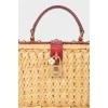 Straw bag with snake leather inserts