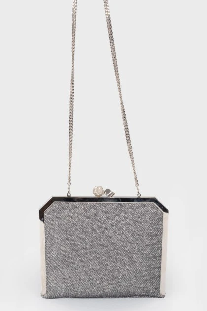Silver shiny clutch on a chain