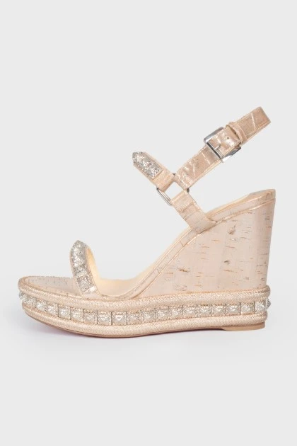 Pink gold sandals on a tanette with a tank