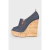 Blue cork wedge sandals with a tag