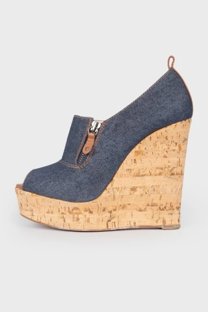 Blue cork wedge sandals with a tag