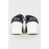 Black and white leather sneakers on lacing