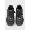 Black and white leather sneakers on lacing