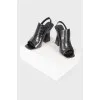 Black leather heeled shoes with open heel and toe