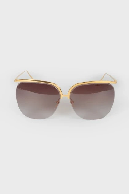 Brown glasses with a golden arc