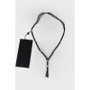 Men's black necklace with tag