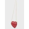 A handbag in the form of a red heart