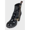 Varnished boots with belt buckle