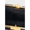 Black leather and gold metal clutch bag