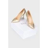 Golden stiletto heels