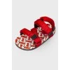 Children's red sandals with a tag