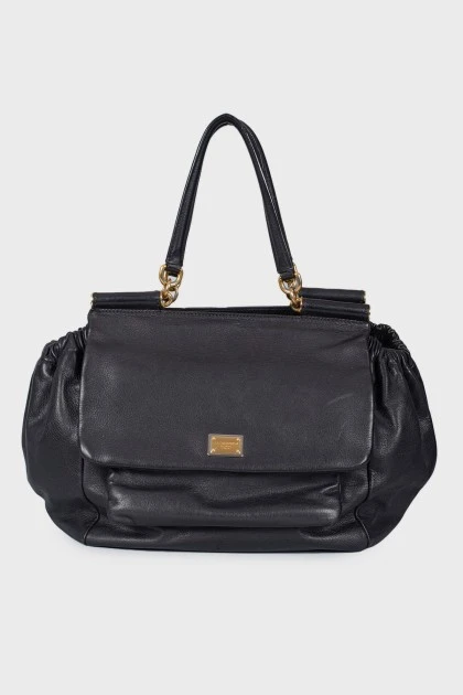 Leather bag, voluminous on the sides