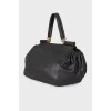 Leather bag, voluminous on the sides