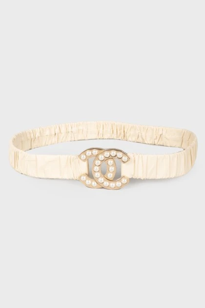 Belt with a logo, decorated with pearls