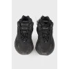Black textile sneakers with tag