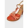 Coral sandals with reptile embossing