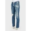 Men's distressed and distressed jeans with paint