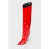 Red boots made of varnish leather